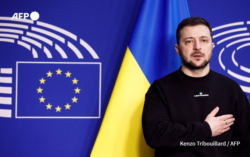 Volodymyr Zelensky poses as he arrives for a summit at EU parliament in Brussels.