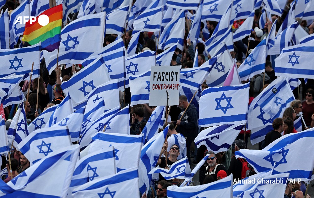 Protesters gather with national flags against government’s plans to overhaul the judiciary, Israel